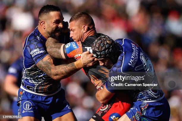 Tariq Sims of the Dragons is tackled during the round 12 NRL match between the Canterbury Bulldogs and the St George Illawarra Dragons at Belmore...
