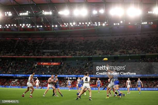 Paddy Ryder of the Saints and Todd Goldstein of the Kangaroos compete for the ball during the round 11 AFL match between the St Kilda Saints and the...