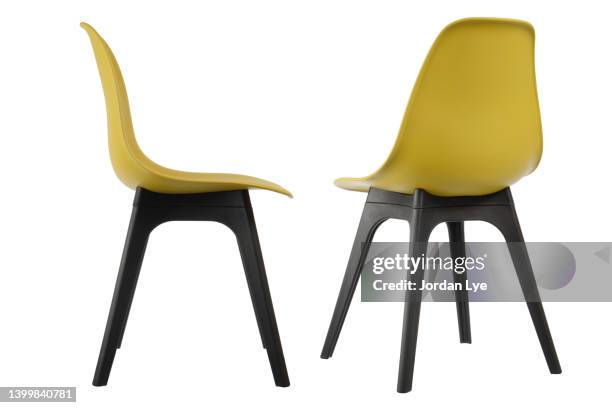 two yellow color office chairs - office chair back fotografías e imágenes de stock