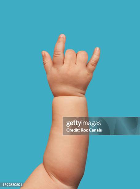 rock & roll baby - baby hand signal stock pictures, royalty-free photos & images
