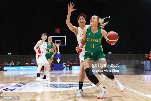 Tess Madgen of the Opals is challenged by Yuki Myazawa of Japan during game two of the International Women's series between Australian Opals and...