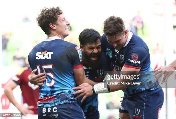 Young Tonumaipea of the Rebels celebrates with teammates after scoring a try during the round 15 Super Rugby Pacific match between the Melbourne...