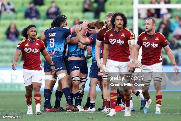 The Rebels celebrate winning around Richard Hardwick after the final whistle of the round 15 Super Rugby Pacific match between the Melbourne Rebels...