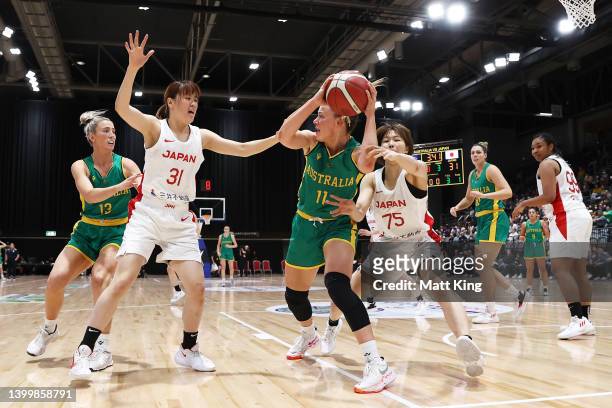 Tess Madgen of the Opals is challenged by Aika Hirashita of Japan during game two of the International Women's series between Australian Opals and...