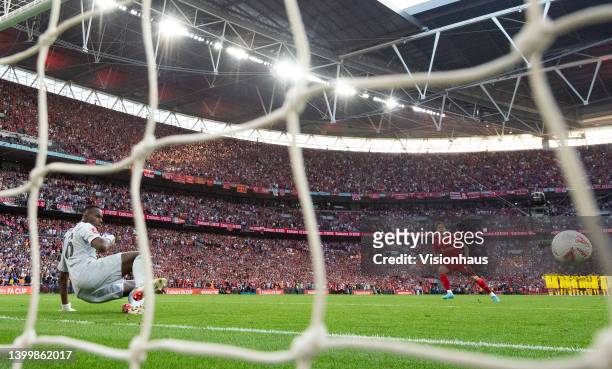 Konstantinos Tsimikas of Liverpool beats Edouard Mendy of Chelsea to score the winning shoot out penalty during the The FA Cup Final match between...