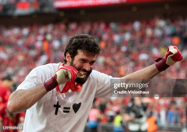 Allison Becker of Liverpool celebrates winning the The FA Cup Final match between Chelsea and Liverpool at Wembley Stadium on May 14, 2022 in London,...