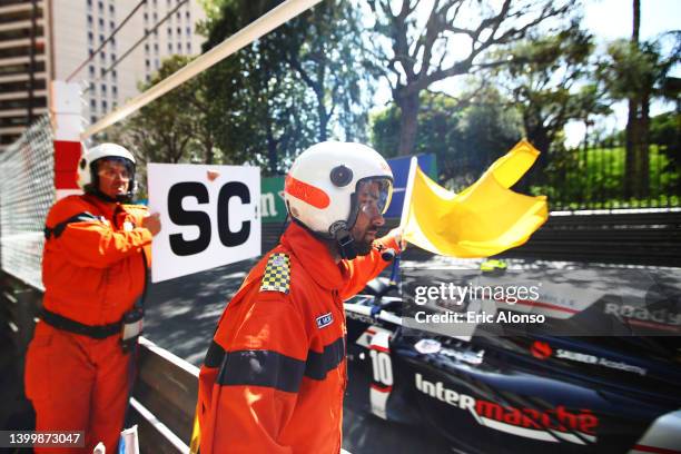 Track marshals signal a safety car period during the Round 5:Monte Carlo Feature race of the Formula 2 Championship at Circuit de Monaco on May 29,...