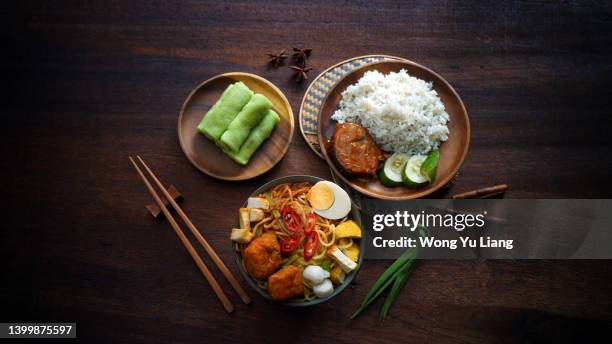 popular malaysian foods , curry noodle, kuih and nasi dagang top down view - heritage shopping centre stock pictures, royalty-free photos & images