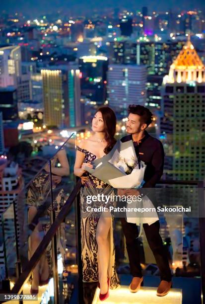 rooftop lover - glamour asian stock pictures, royalty-free photos & images