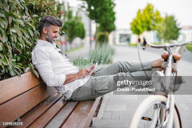 making business connections throughout the city - suave stock pictures, royalty-free photos & images