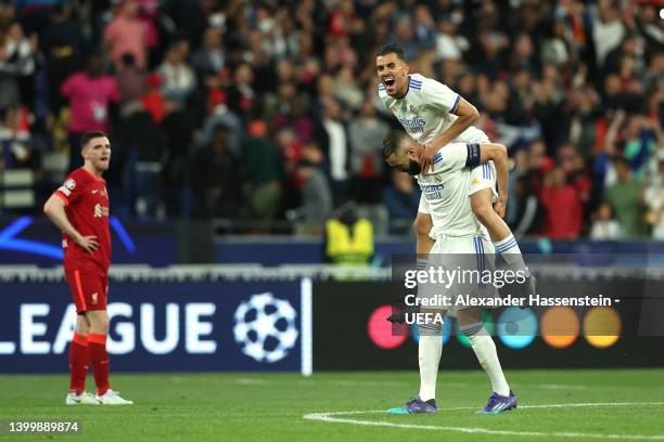 Karim Benzema and Dani Ceballos of Real Madrid celebrate after their sides victory during the UEFA Champions League final match between Liverpool FC...