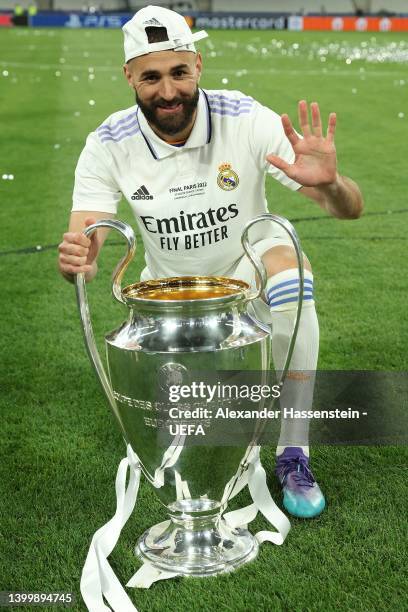 Karim Benzema of Real Madrid celebrates with the UEFA Champions League trophy after their sides victory during the UEFA Champions League final match...