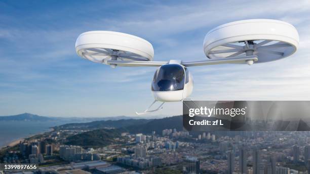 evtol traffic in the skies - car mid air stock pictures, royalty-free photos & images
