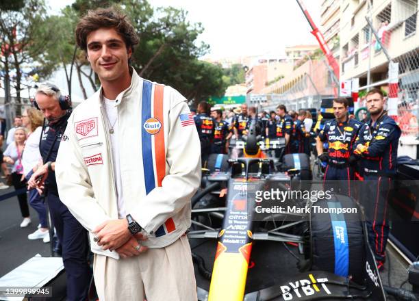 Jacob Elordi poses for a photo with the car of Max Verstappen of the Netherlands and Oracle Red Bull Racing on the grid during the F1 Grand Prix of...