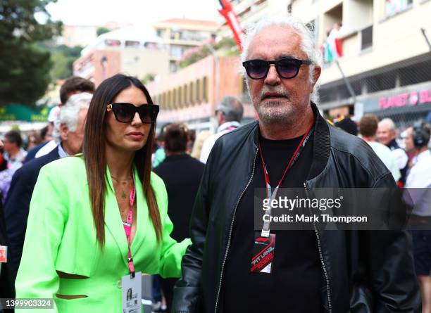 Flavio Briatore and Elisabetta Gregoraci walk on the grid ahead of the F1 Grand Prix of Monaco at Circuit de Monaco on May 29, 2022 in Monte-Carlo,...