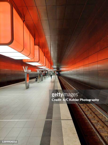 underground station "hafencity universität" in hamburg hafencity with red illumination - metro hamburg stock pictures, royalty-free photos & images