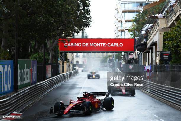 Charles Leclerc of Monaco driving the Ferrari F1-75 leads Carlos Sainz of Spain driving the Ferrari F1-75 and the rest of the field on a formation...