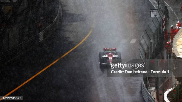 Zhou Guanyu of China driving the Alfa Romeo F1 C42 Ferrari on a formation lap in the rain during the F1 Grand Prix of Monaco at Circuit de Monaco on...