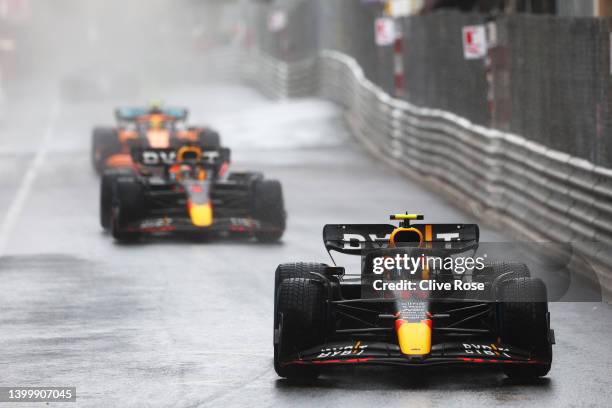 Sergio Perez of Mexico driving the Oracle Red Bull Racing RB18 leads Max Verstappen of the Netherlands driving the Oracle Red Bull Racing RB18 on a...