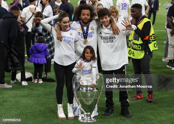 Marcelo of Real Madrid poses with his wife Clarice Alves and children Enzo Gattuso Alves Vieira and Liam Alves Vieira following the 1-0 victory in...