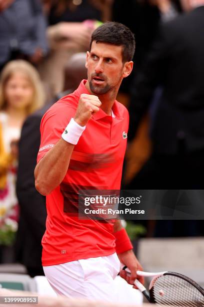 Novak Djokovic of Serbia celebrates after winning match point against Diego Schwartzman of Argentina during the Men's Singles Fourth Round match on...