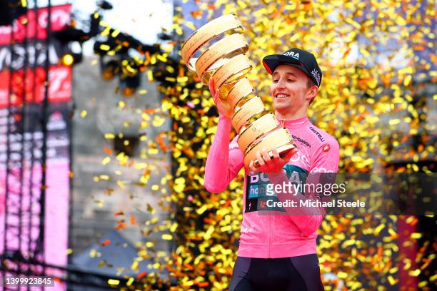 Jai Hindley of Australia and Team Bora - Hansgrohe Pink Leader Jersey celebrates at podium with the Trofeo Senza Fine as overall race winner during...