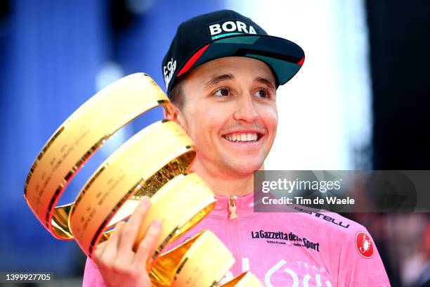 Jai Hindley of Australia and Team Bora - Hansgrohe Pink Leader Jersey celebrates at podium with the Trofeo Senza Fine as overall race winner during...