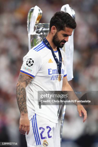 Isco of Real Madrid walks past the trophy following the UEFA Champions League final match between Liverpool FC and Real Madrid at Stade de France on...