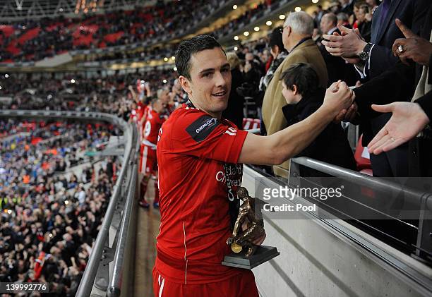 Stewart Downing of Liverpool holds the Hardaker man of the match trophy after the Carling Cup Final match between Liverpool and Cardiff City at...