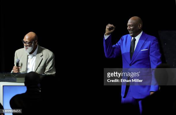 Basketball Hall of Fame member Spencer Haywood gives a Black Power salute after introducing former track and field athlete John Carlos to present the...