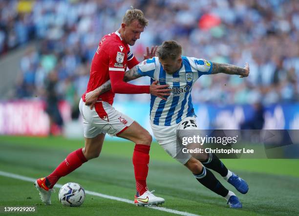 Daniel Ward of Huddersfield holds off pressure from Joe Worrall of Nottingham Fores during the Sky Bet Championship Play-Off Final match between...