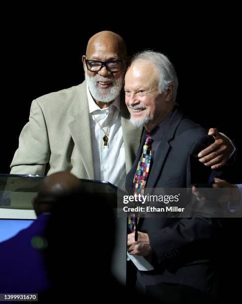 Former track and field athlete John Carlos presents the John Carlos and Tommie Smith Social Justice Champion Award to Dr. Richard Lapchick at the...