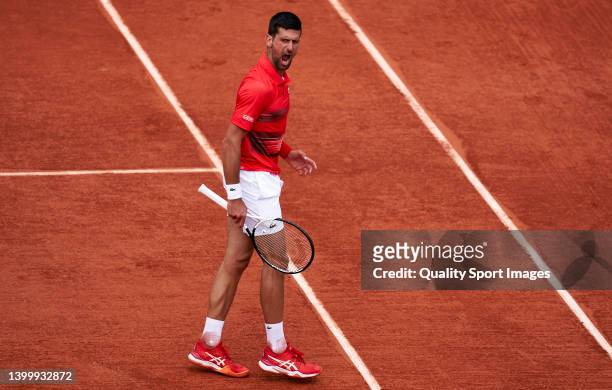 Novak Djokovic of Serbia celebrates against Diego Schwartzman of Argentina in their fourth round match during day eight of the 2022 French Open at...