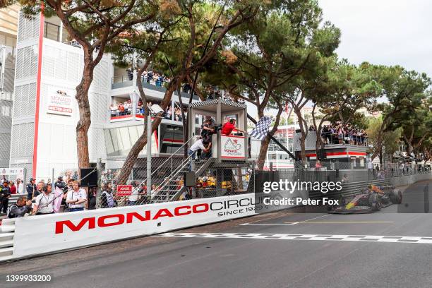 Sergio Perez of Mexico and Red Bull Racing takes the chequered flag during the F1 Grand Prix of Monaco at Circuit de Monaco on May 29, 2022 in...