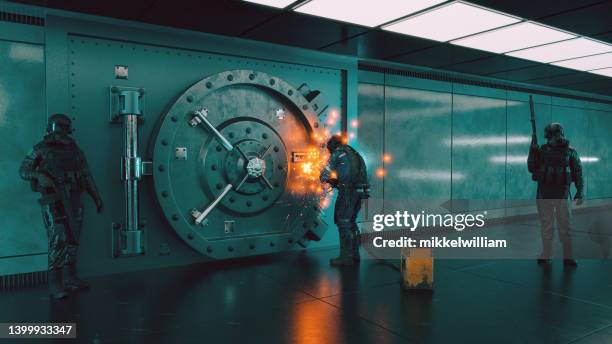 gang of robber tries to enter vault with a welding torch - the intruder imagens e fotografias de stock