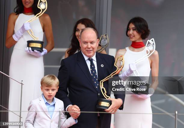 Prince Albert of Monaco and his son Prince Jacques of Monaco collect the race winners trophy to present it on the podium during the F1 Grand Prix of...