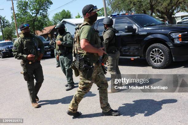 Law enforcement officials prepare for the arrival of President Joe Biden's attendance for mass at Sacred Heart Catholic Church on May 29, 2022 in...