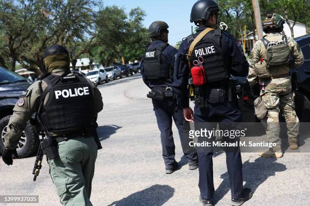 Law enforcement officials prepare for the arrival of President Joe Biden's attendance for mass at Sacred Heart Catholic Church on May 29, 2022 in...