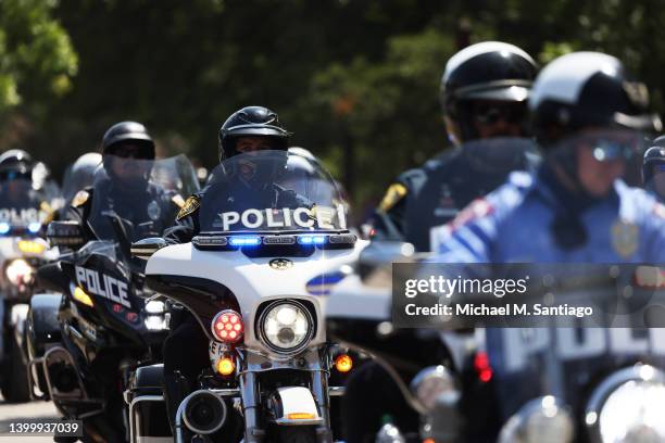 Law enforcement officials prepare for the arrival of President Joe Biden's attendance for mass at Sacred Heart Catholic Church on May 29, 2022 in...