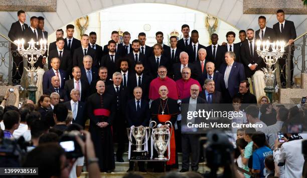 Players and board members of Real Madrid pose during the celebration of the recent win of the UEFA Champions League title at Almudena Cathedral on...