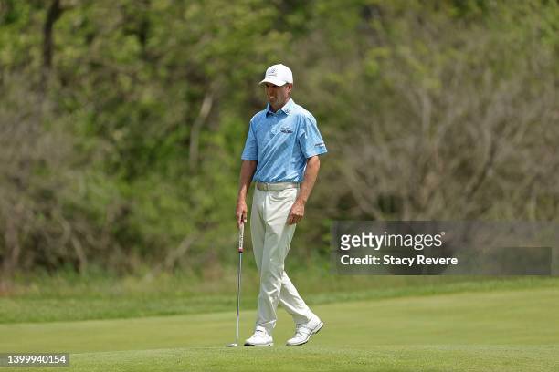 Steven Alker of New Zealand walks to the first green during the final round of the Senior PGA Championship presented by KitchenAid at Harbor Shores...