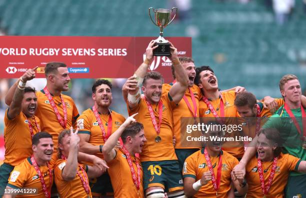 The Australian team celebrate with the trophy after beating New Zealand in the final of the HSBC World Rugby Sevens Series on May 29, 2022 in London,...