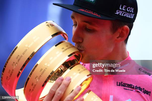 Jai Hindley of Australia and Team Bora - Hansgrohe Pink Leader Jersey celebrates at podium with the Trofeo Senza Fine as overall race winner during...