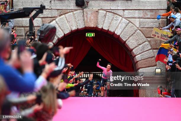 Jai Hindley of Australia and Team Bora - Hansgrohe Pink Leader Jersey crosses the finish line and waves the crowd at the Arena di Verona during the...