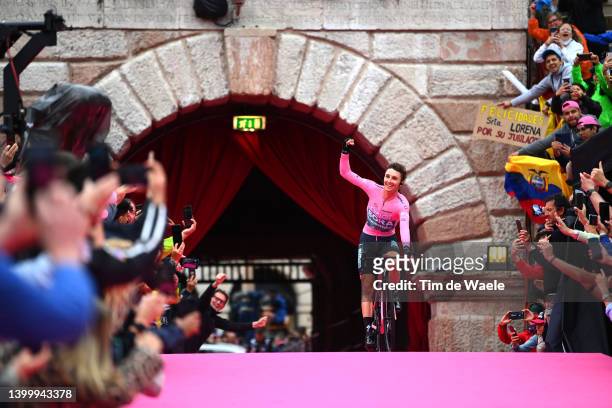 Jai Hindley of Australia and Team Bora - Hansgrohe Pink Leader Jersey crosses the finish line and waves the crowd at the Arena di Verona during the...