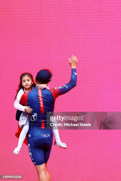Richard Carapaz of Ecuador and Team INEOS Grenadiers celebrates at podium as second overall place with his daughter Sofia during the 105th Giro...