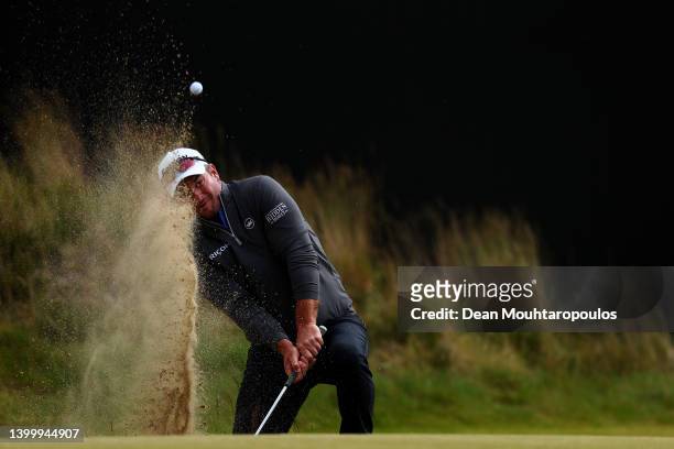 Ryan Fox of New Zealand chips his third shot onto the 18th green in his play off match against Victor Perez of Fance during the final round of the...