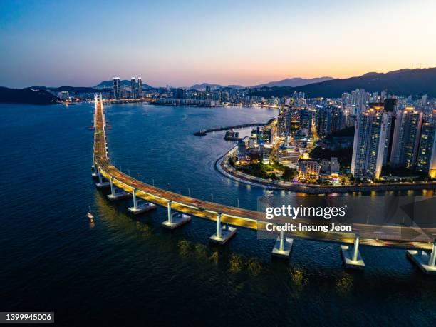 aerial view of busan cityscape at night - busan stockfoto's en -beelden