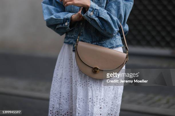 Aline Kaplan is seen wearing a Mango jeans jacket, French Connection white dress, Ray Ban shades, Agneel beige bag and Chanel white sandals on May...