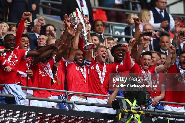 Lewis Grabban and Joe Worrall of Nottingham Forest lift the trophy following their team's victory in the Sky Bet Championship Play-Off Final match...